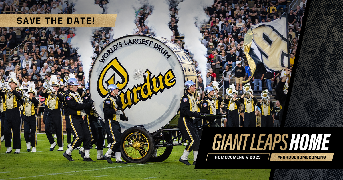 The Purdue All-American Marching Band and the World's Largest Drum on the field at Ross-Ade Stadium. A text banner reads, "Giant Leaps Home."